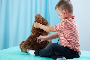 Child Playing At Doctor